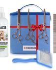 Blue zip bag with red ribbon and We Love Doodles patch, three bronze grooming scissors, metal comb, blue slicker brush, and a white unscented detangler bottle shown together.