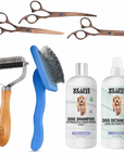 Flat lay collage shows three rose gold grooming scissors with a metal comb, a blue slicker brush, a wood handle dematting rake, and two bottles labeled dog shampoo and dog detangler.