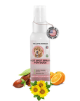 White 4 fl oz spray bottle labeled Hot Spot Spray for Dogs with a Made in the USA tag. Jojoba seeds, sunflower blooms, grapefruit, and grape seed oil sit around the bottle.