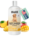 White We Love Doodles Puppy Shampoo bottle labeled extra gentle calming and tearless. Silver cap with mango fruits at the base. A mint hang tag reads Made in USA.