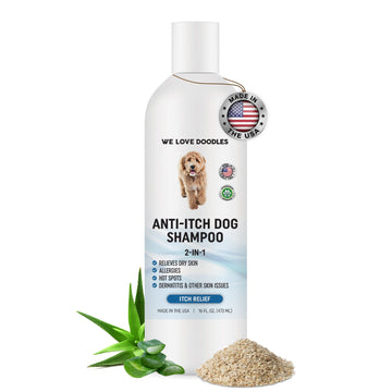 White 16 fl oz bottle labeled Anti itch Dog Shampoo with a dog graphic and USA badge. Aloe leaves and ground oats sit at the base on a white background.