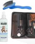 Blue slicker brush, 16 oz dog detangler bottle, and rose gold scissor set with metal comb in a zip case on a white background.