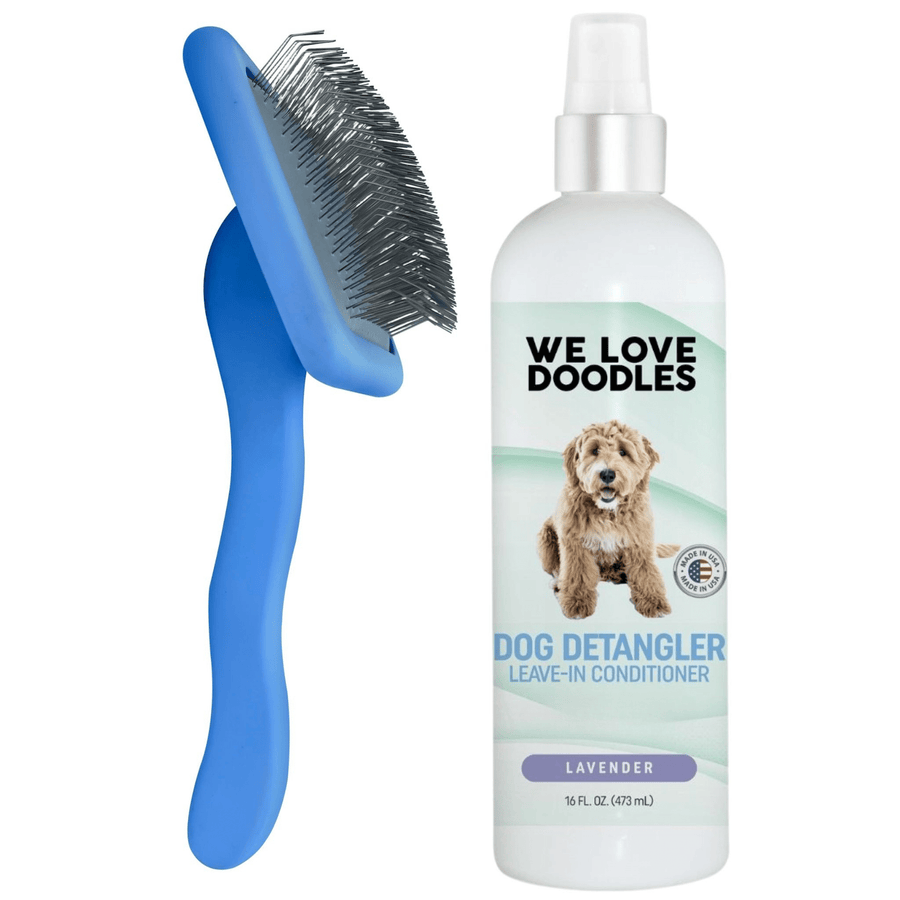A blue slicker brush with long bent pins stands beside a white bottle labeled Dog Detangler Leave In Conditioner lavender on a clean white background.