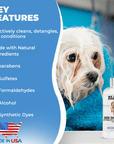 A small wet dog wrapped in a blue towel sits next to a We Love Doodles shampoo bottle. Text notes cleans detangles and conditions and lists no parabens or sulfates.