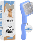 Blue slicker brush with long angled metal pins shown next to a branded box that reads Dog Slicker Brush extra small. A hang tag notes removes tangles knots and mats.