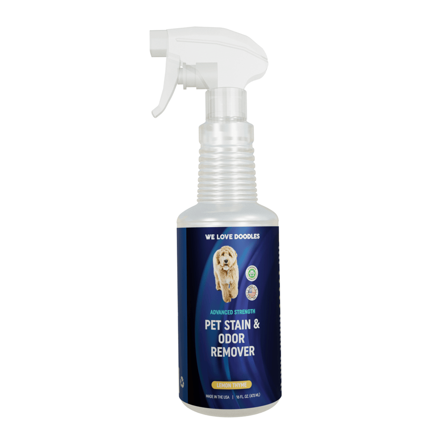 Single trigger spray bottle with ribbed neck and a blue We Love Doodles label showing Advanced Strength Pet Stain and Odor Remover Lemon Thyme on a plain white background.