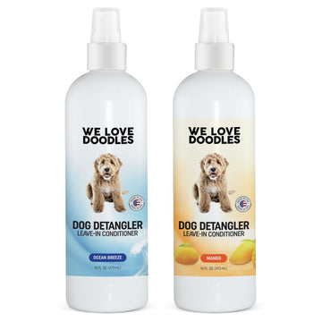 Two white We Love Doodles detangler bottles with a doodle dog on the label. Left is blue Ocean Breeze. Right is mango orange. Both are 16 fl oz leave in conditioner.