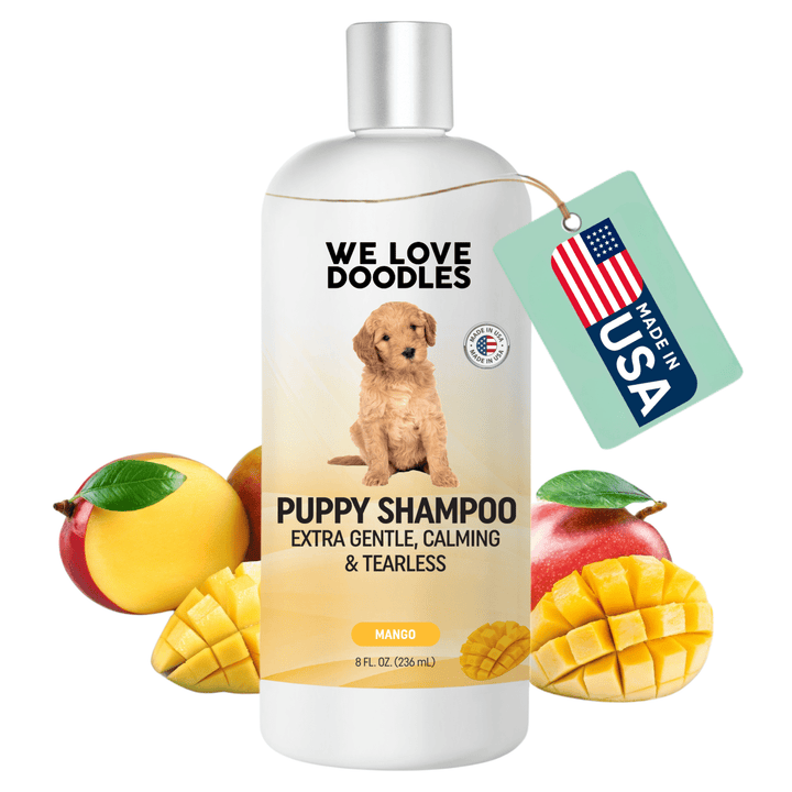 White We Love Doodles Puppy Shampoo bottle labeled extra gentle calming and tearless. Silver cap with mango fruits at the base. A mint hang tag reads Made in USA.
