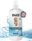 White 16 oz spray bottle labeled Dog Detangler Leave In Conditioner with blue wave graphics and a Made in the USA badge shown over a water splash background.