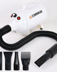 White cylindrical We Love Doodles dog dryer with a flexible black hose and four black attachments flat, wedge, round, and comb on a clean white background.